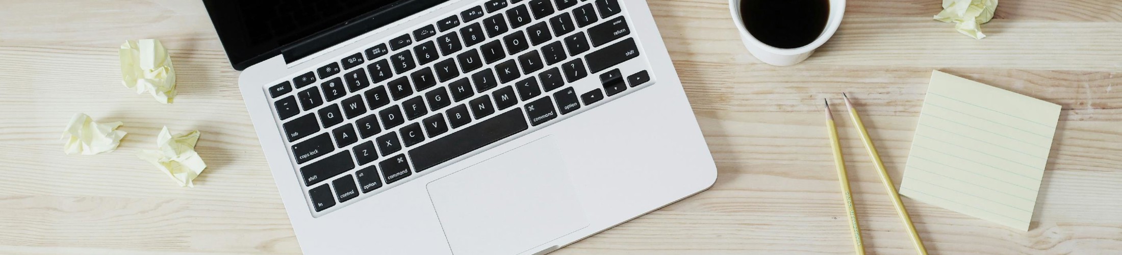 turned off MacBook Pro beside white ceramic mug filled with coffee turned off MacBook Pro beside white ceramic mug filled with coffee